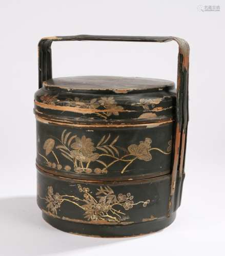 Japanese Meiji period lacquered tiered basket, with an arched handle above the three containers