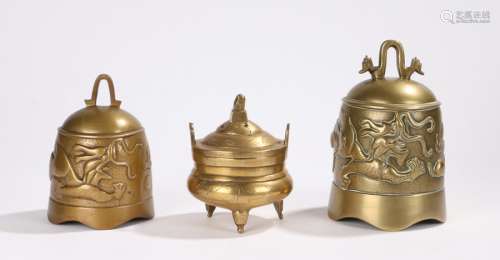 Two Chinese brass bells, the bells decorated with dragons pursuing the pearl of wisdom and a