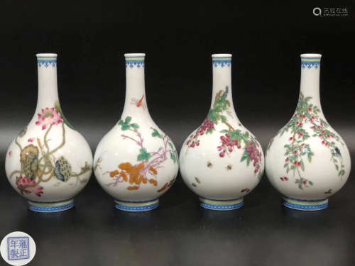FOUR ENAMELED FLORAL PATTERN SMALL VASES