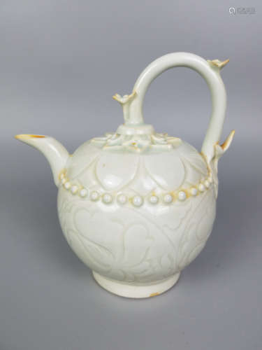 A HUTIAN YAO INCISED FLORAL PATTERN EWER