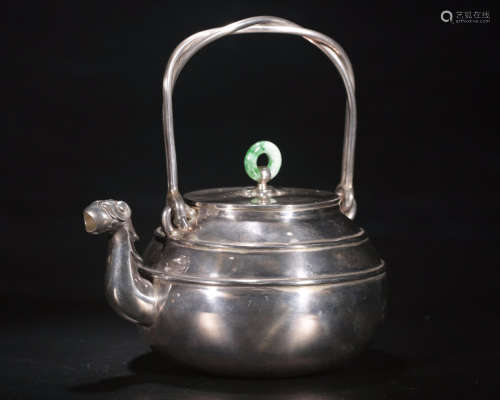 A SILVER MOLDED HANDLE WATER POT