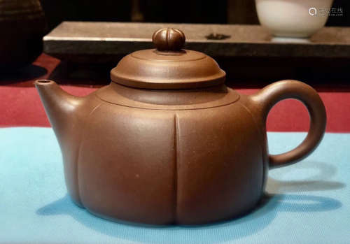 A PETAL SHAPED ZISHA TEAPOT