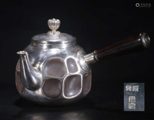A SILVER MOLDED WATER POT