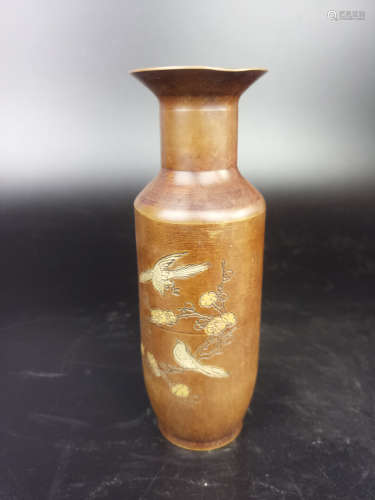 A FLORAL AND BIRD PATTERN COPPER VASE