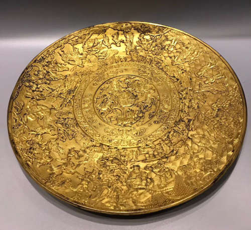 A GILT COPPER PLATE WITH MARK
