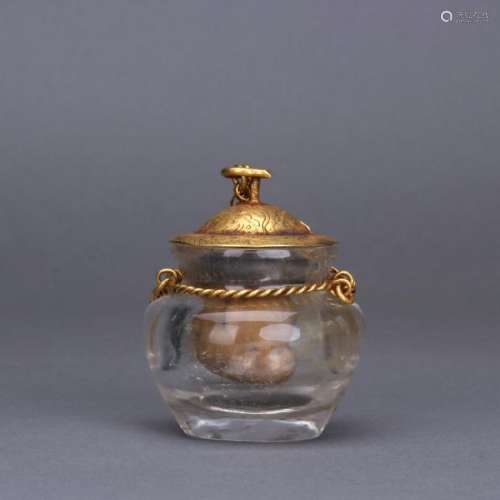 A rock crystal jar with gilt bronze cover