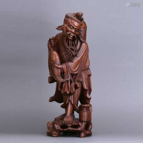 An old carved Huangying wood fishman figure