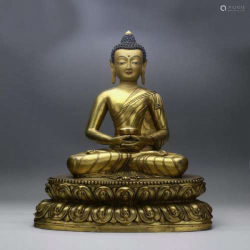 A gilt bronze seated figure of Sakyamuni