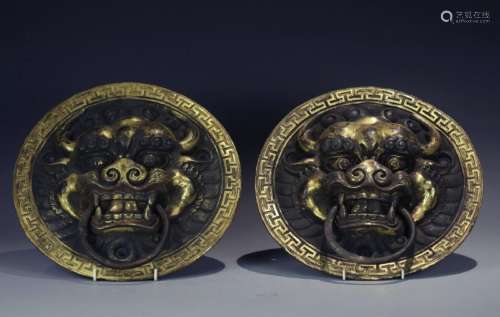 Pair of gilt bronze door knockers lion face