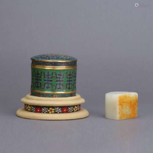 A white jade carved archer's ring with cloisonne box