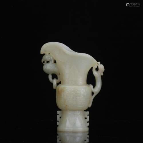 A white jade carved jug with dragon handle