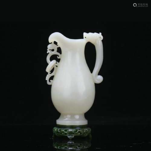 A white jade carved dragon handle jug
