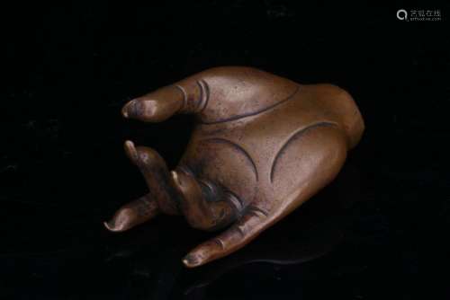 An old bronze Buddha hand figure