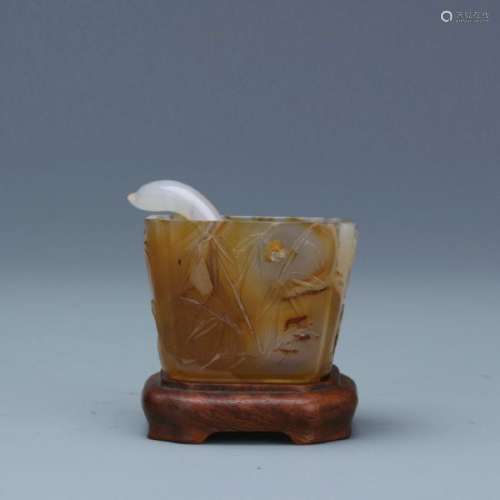 A nice carved agate water pot with spoon
