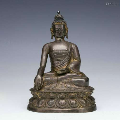 A silver figure of Sakyamuni