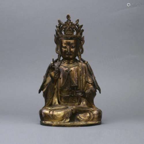 A gilt bronze figure of seated Guanying