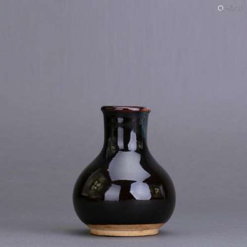 A black glazed vase