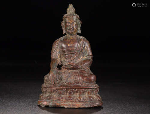 A COPPER BUDDHA FIGURE