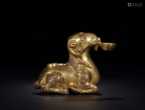 A GILT COPPER SHEEP SHAPED WATER DROPPER