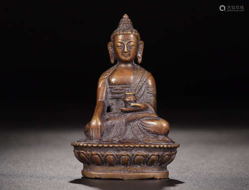 A COPPER SITTING BUDDHA STATUE