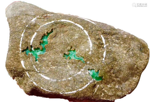 A BURMESE GREEN JADEITE STONE, A CLASS