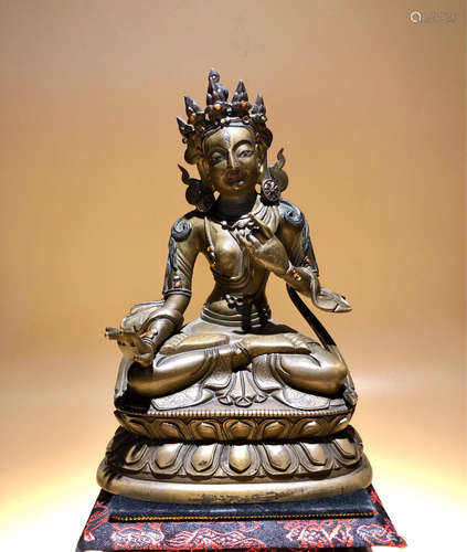 A GLIT BRONZE CASTED GREEN TARA BUDDHA