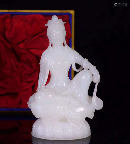 A HETIAN JADE CARVED GUANYIN FIGURE