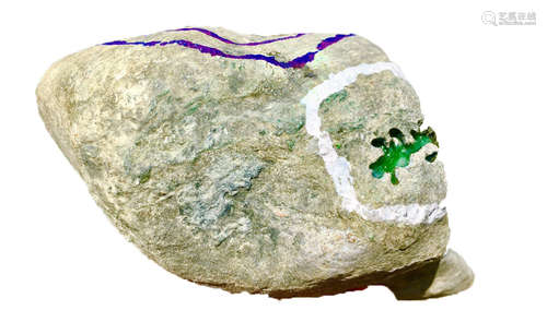 A BURMESE GREEN JADEITE STONE, A CLASS