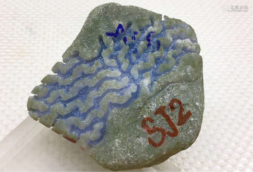 A BURMESE PURPLE JADEITE STONE, A CLASS