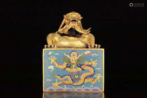 A GILT CLOISONNE DRAGON SHAPED SEAL