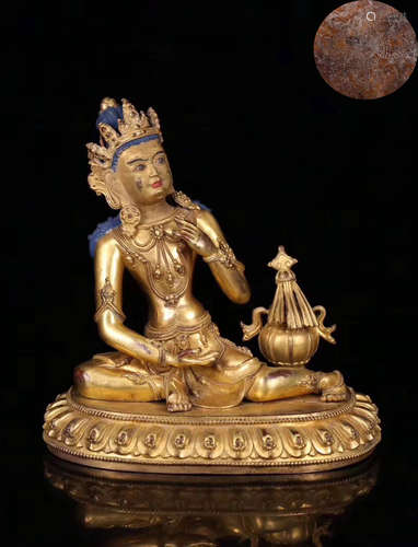 A GILT BRONZE MOLDED BUDDHA STATUE WITH MARK