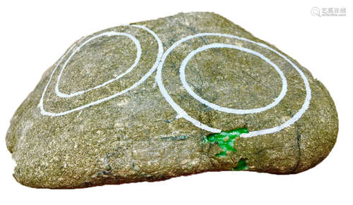 A BURMESE GREEN JADEITE STONE, A CLASS