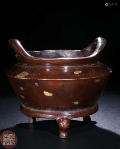 A BRONZE CASTED PHOENIX EYE PATTERN EAR CENSER