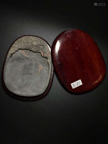 A RED WOOD CARVED GRAGON SHAPED INK SLAB