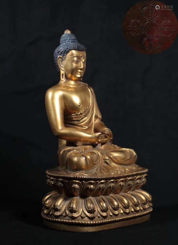 A GILT BRONZE MOLDED SHAKYAMUNI BUDDHA