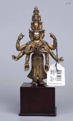 A BRONZE CASTED MULTI-FACE GUANYIN BUDDHA