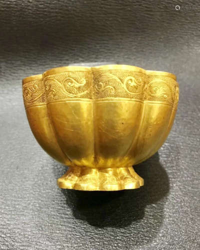 A GOLD CASTED WRAPPED MELON SHAPED BOWL