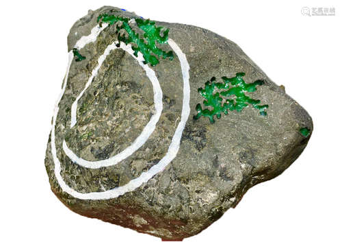 A BURMESE GREEN JADEITE STONE, A CLASS