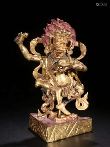 A TIBETAN GILT BONZE PROTECTOR BUDDHA