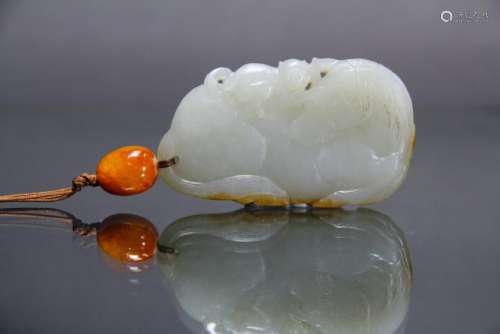 A  'HORSE AND MONKEY' WHITE JADE WITH AMBER BEADS