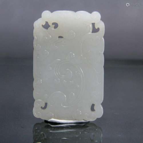 A WHITE JADE CRAVED 'DRAGON' PENDANT, QING DYNASTY