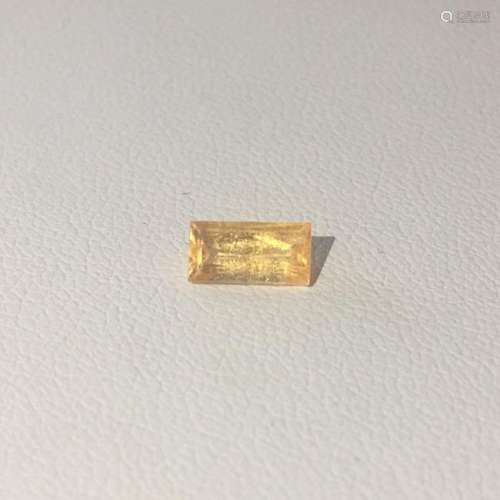 0.87 CT Baguette cut yellow sapphire.