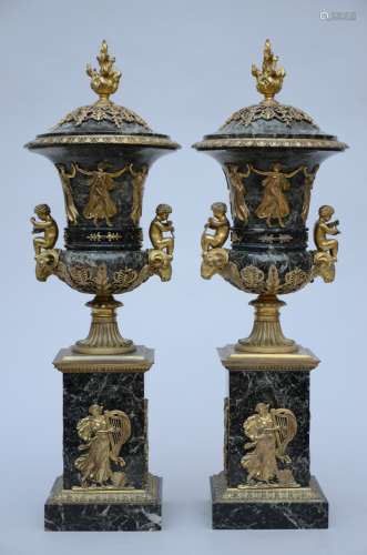 A pair of Empire style vases in green marble and bronze