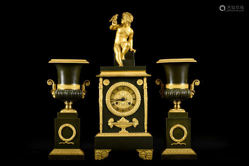 Bronze empire clock with a pair of bronze vases