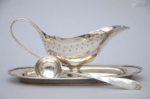 Silver sauce bowl with spoon