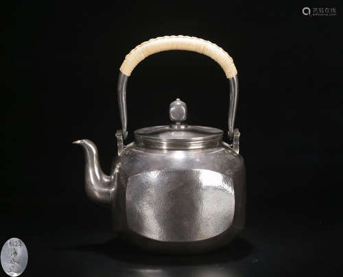 A SILVER CASTED MULTI FACED TEA POT