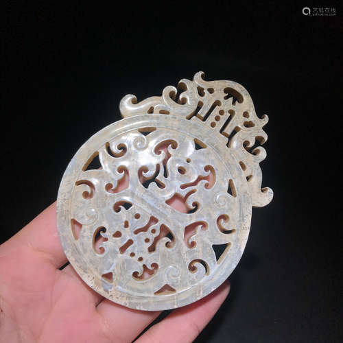 A HEJIAN JADE CARVED HOLLOW PATTERN PENDANT