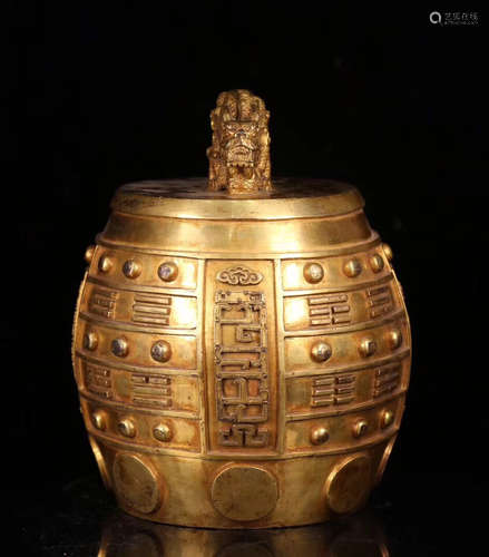 A GILT COPPERN BELL SHAPED HANDLE POT