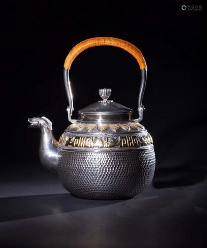 A SILVER CASTED GILT PHOENIX PATTERN TEA POT