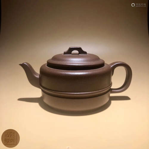 A CLAY CASTED TEA POT